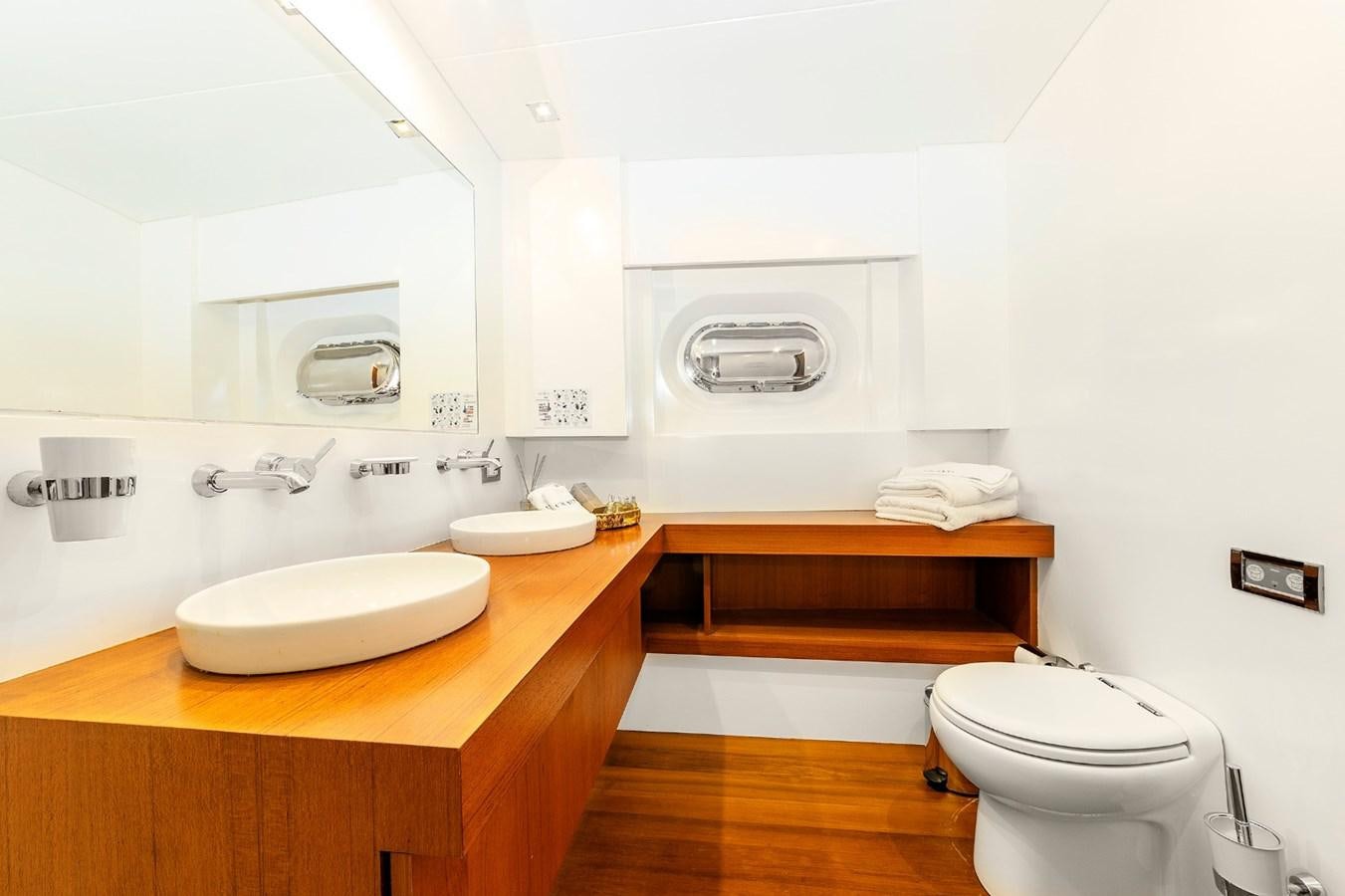 a bathroom with a sink toilet and a bathtub aboard UBI BENE Yacht for Sale