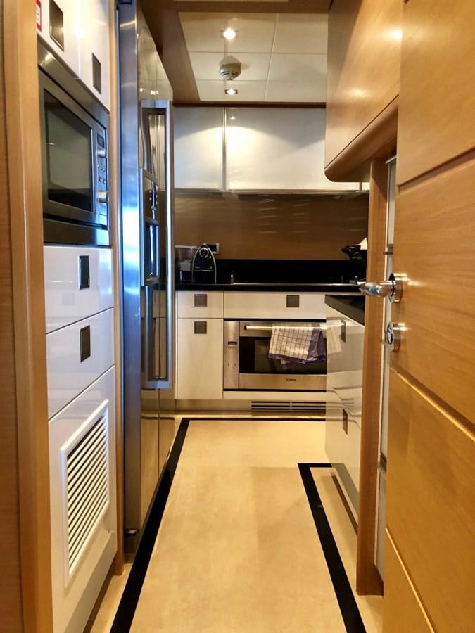 a kitchen with a stainless steel oven aboard THIRTEEN Yacht for Sale