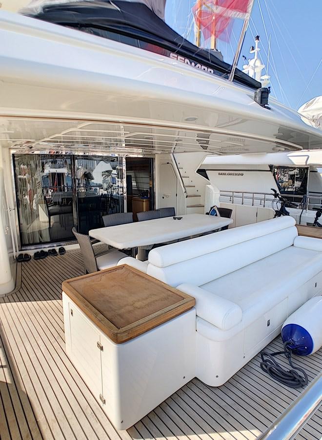 a room with a bed and a table aboard THIRTEEN Yacht for Sale