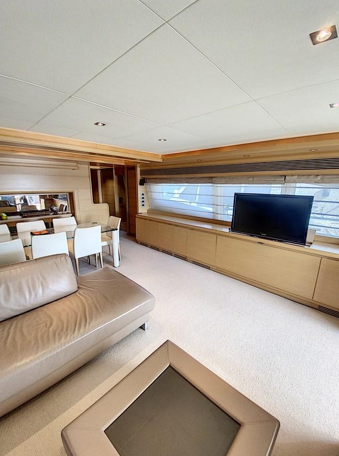 a living room with a couch and a tv aboard THIRTEEN Yacht for Sale