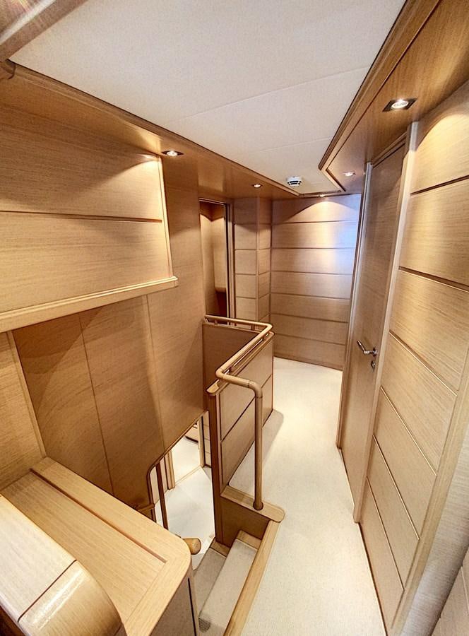 a hallway with wooden walls aboard THIRTEEN Yacht for Sale