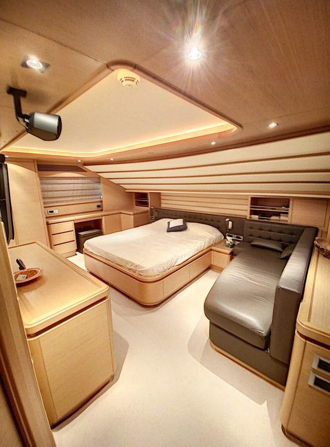 a room with a bed and a desk aboard THIRTEEN Yacht for Sale