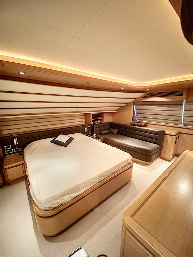 a room with a bed and a desk aboard THIRTEEN Yacht for Sale