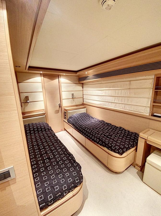 a bedroom with a bed and a rug aboard THIRTEEN Yacht for Sale