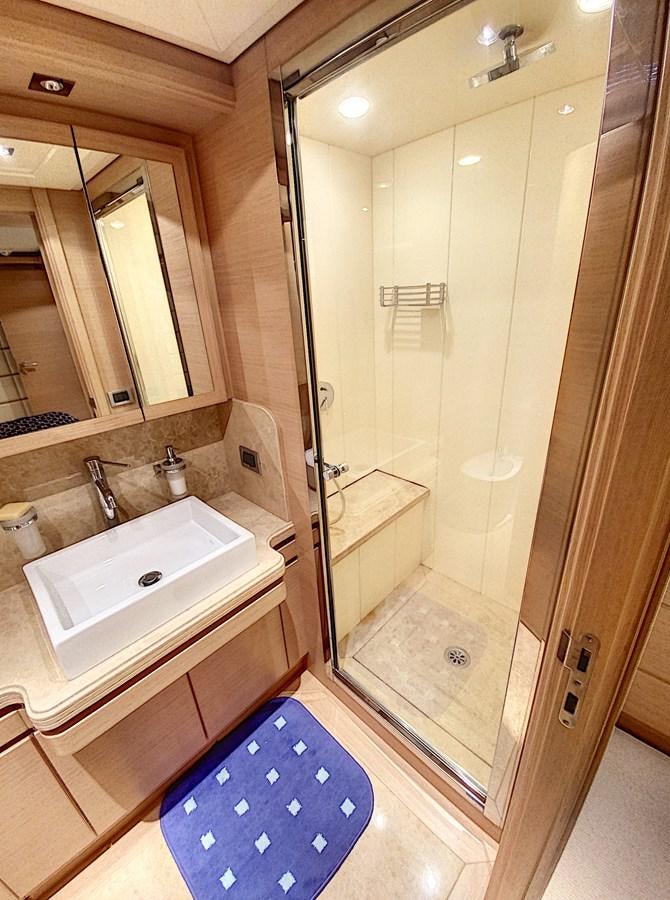 a bathroom with a sink and a shower aboard THIRTEEN Yacht for Sale