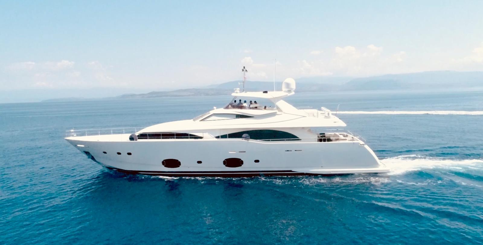 a white yacht in the water aboard THIRTEEN Yacht for Sale