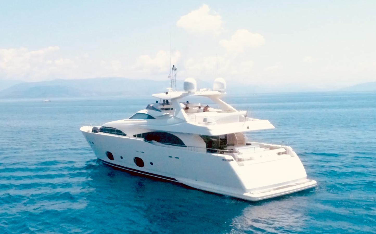 a white yacht in the water aboard THIRTEEN Yacht for Sale