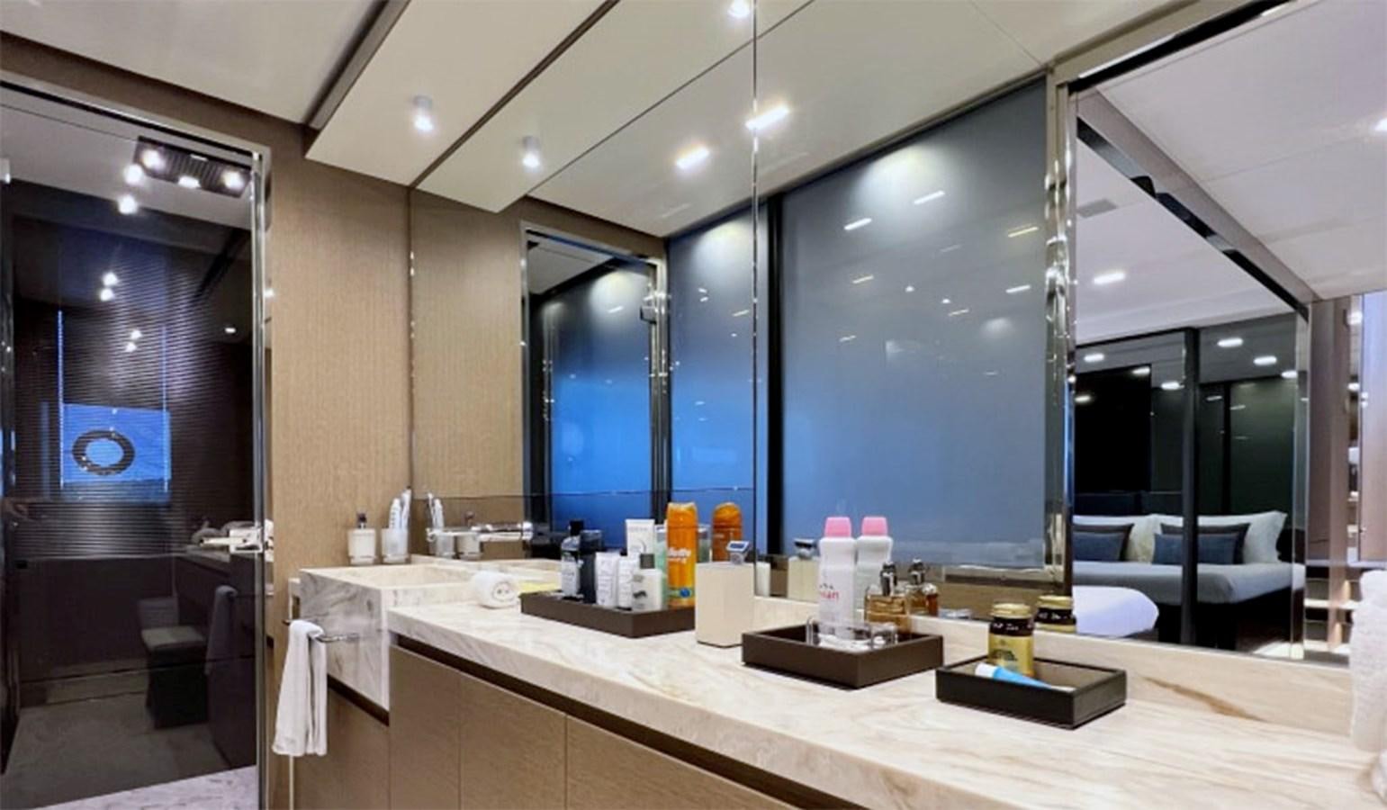 a bathroom with a large mirror aboard KAR Yacht for Sale