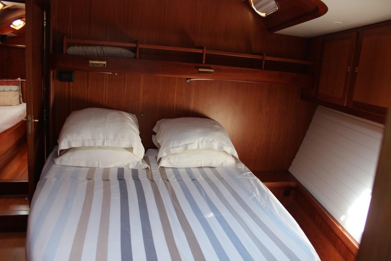 a bed with white sheets aboard HEIDENSKIP Yacht for Sale