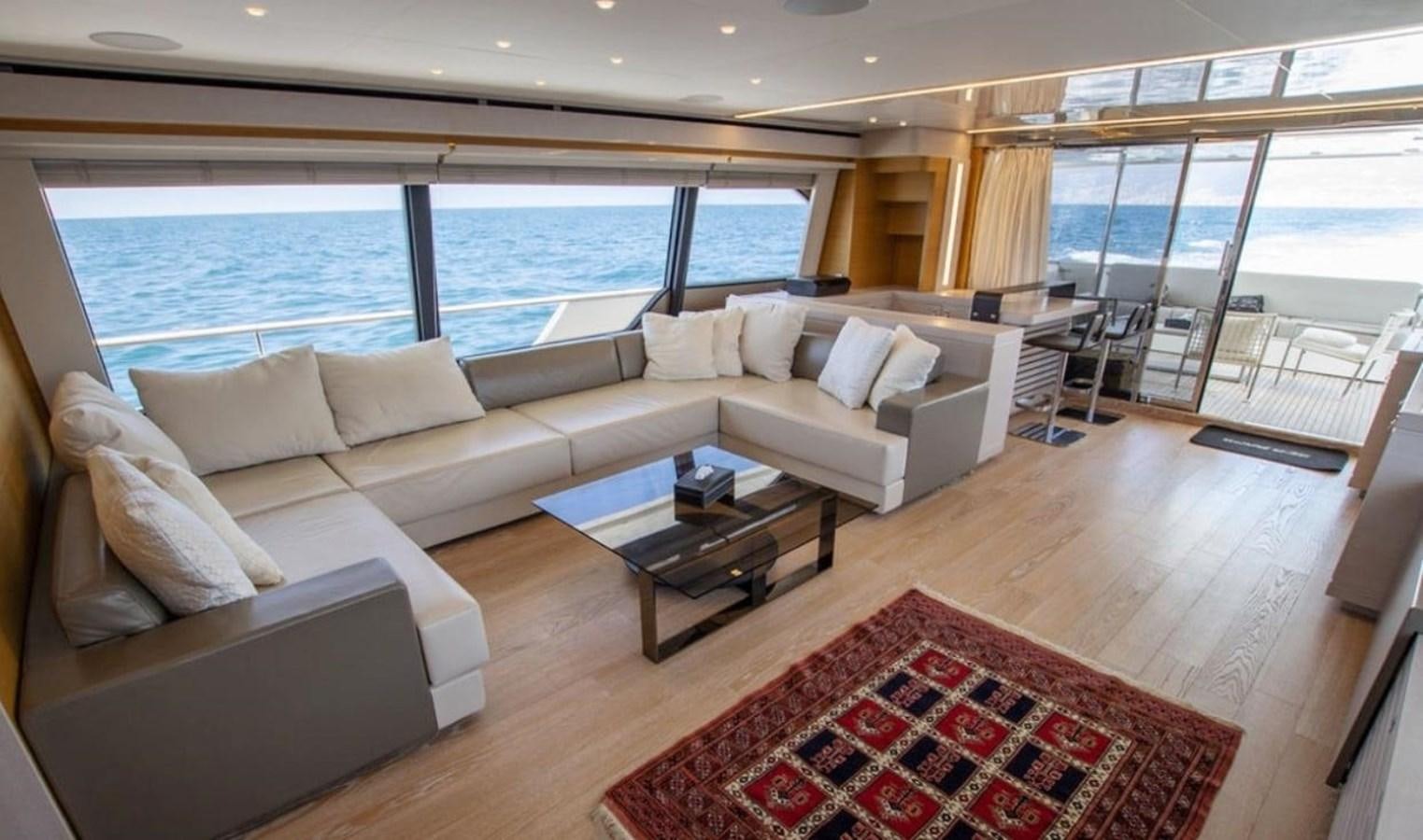 a living room with a large window aboard NAVETTA 28 Yacht for Sale