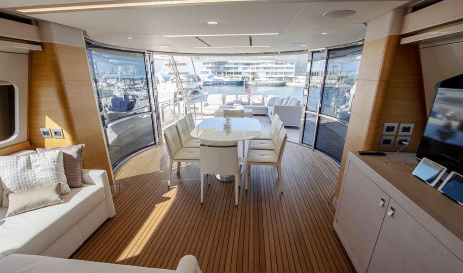 a room with a table and chairs aboard NAVETTA 28 Yacht for Sale