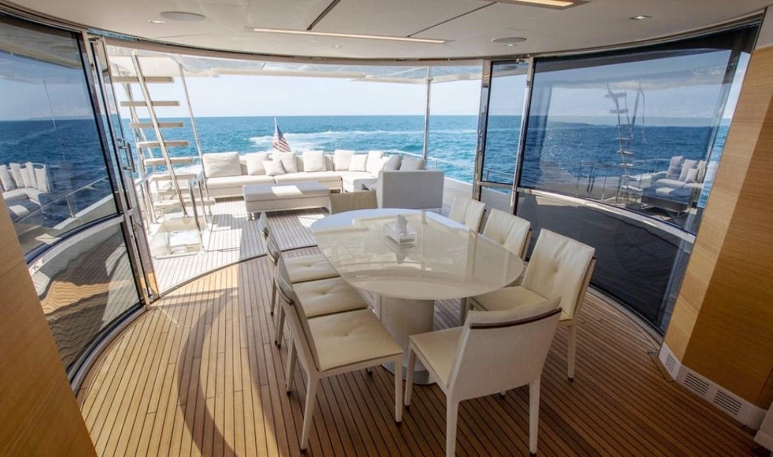 a room with a table and chairs aboard NAVETTA 28 Yacht for Sale
