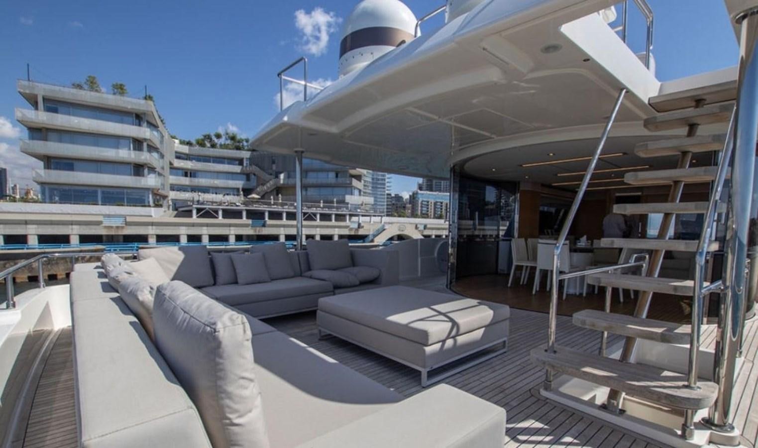 a large room with a couch and a table aboard NAVETTA 28 Yacht for Sale