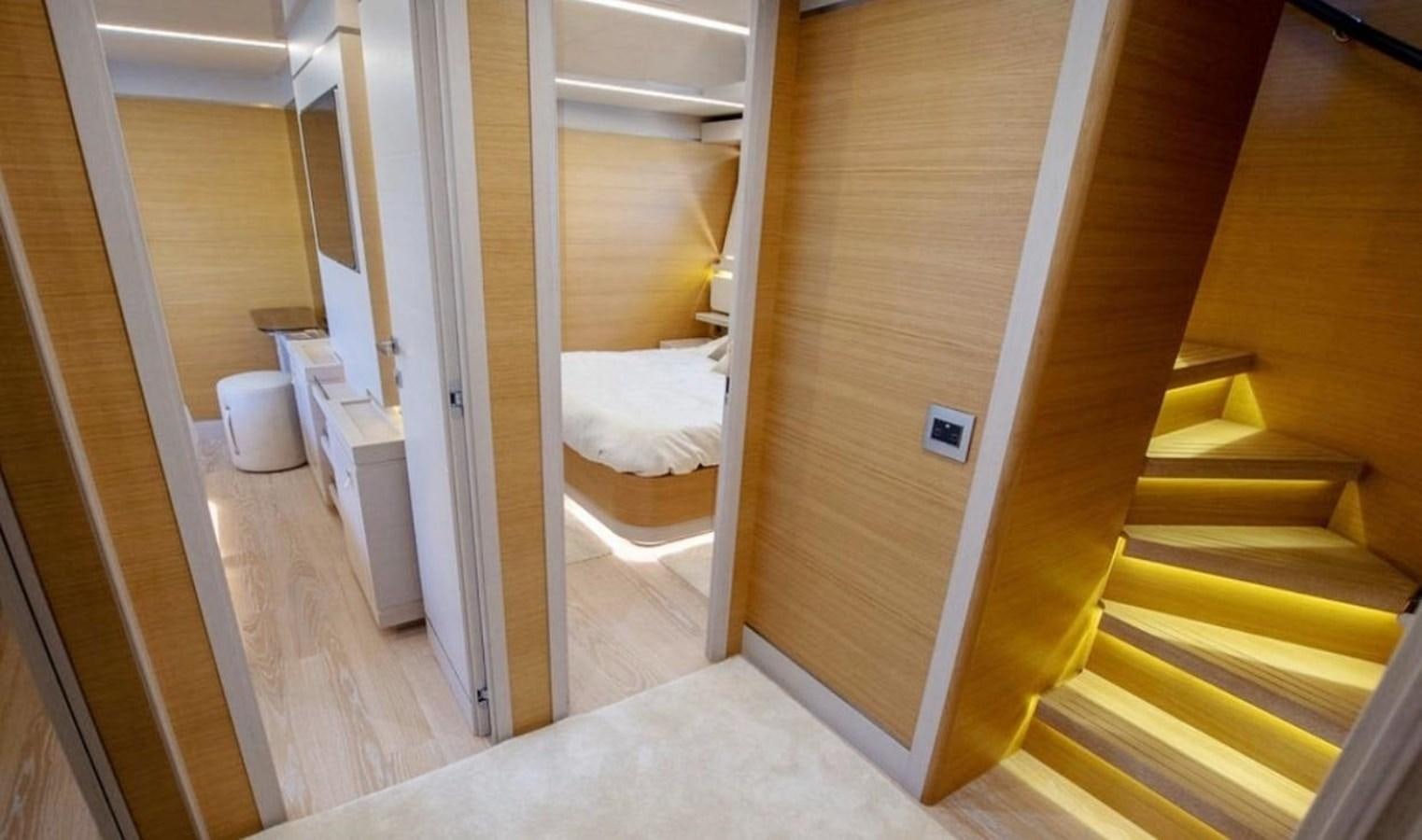 a room with a bed and a closet aboard NAVETTA 28 Yacht for Sale