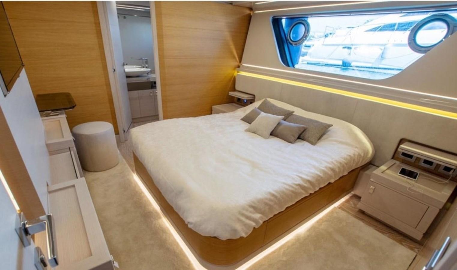 a room with a bed and a window aboard NAVETTA 28 Yacht for Sale
