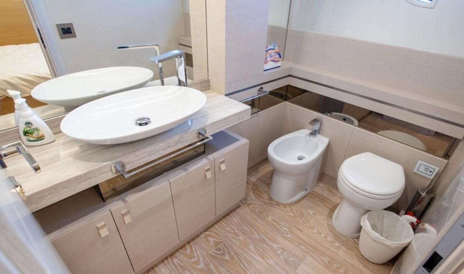 a bathroom with a sink and a toilet aboard NAVETTA 28 Yacht for Sale