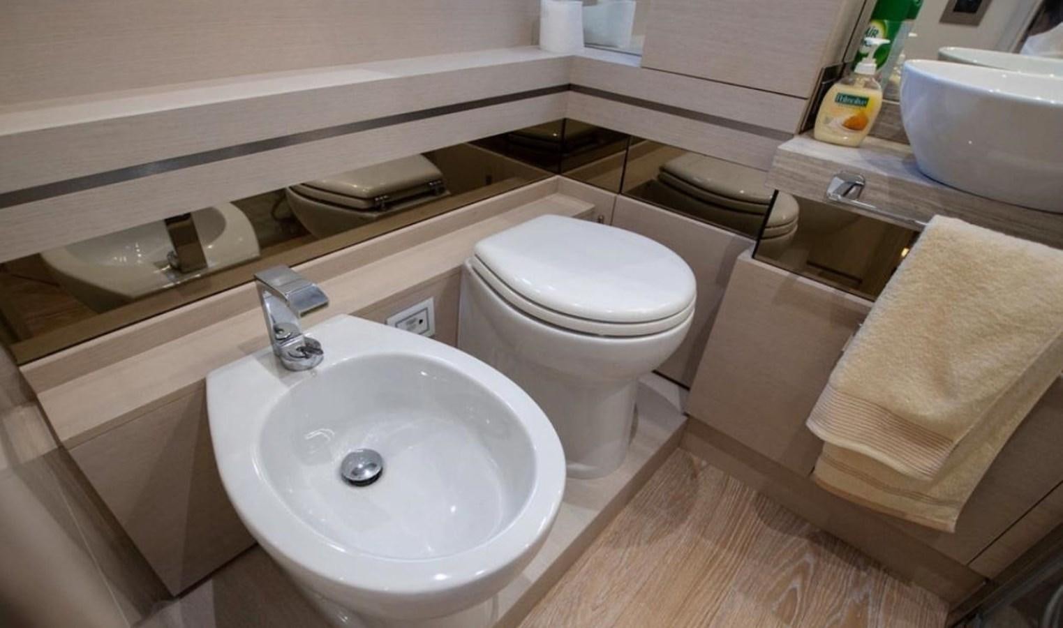 a bathroom with a sink and toilet aboard NAVETTA 28 Yacht for Sale
