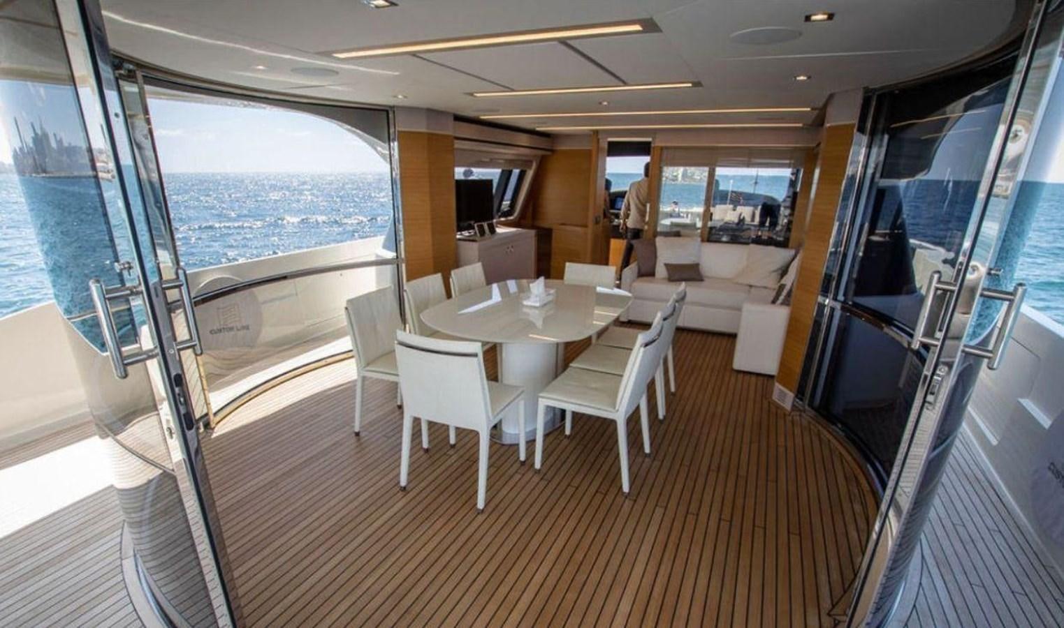 a room with a table and chairs aboard NAVETTA 28 Yacht for Sale