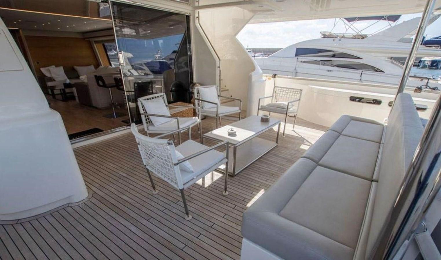 a room with a table chairs and a couch aboard NAVETTA 28 Yacht for Sale