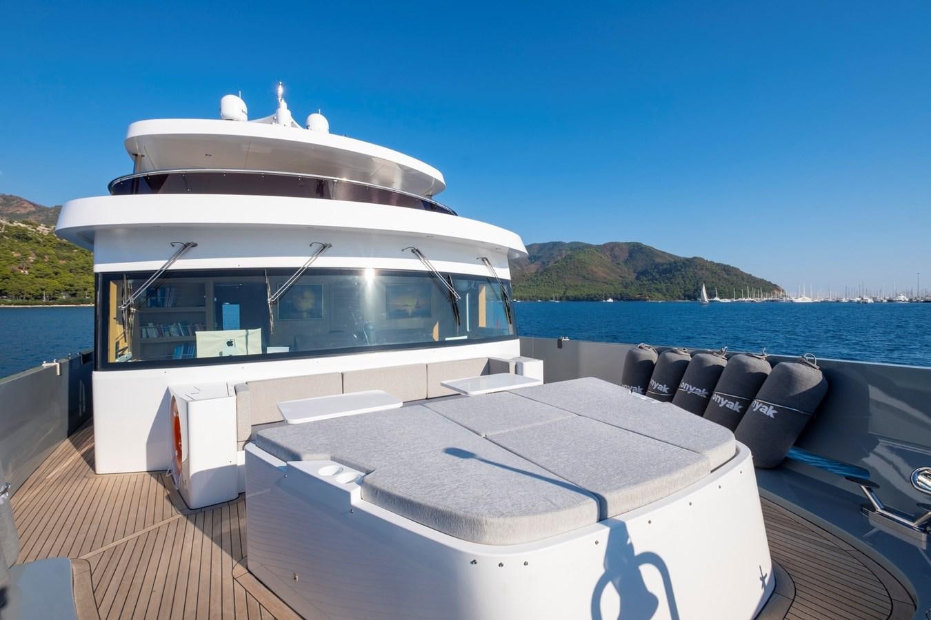 a boat on a dock aboard MURAL 85 Yacht for Sale