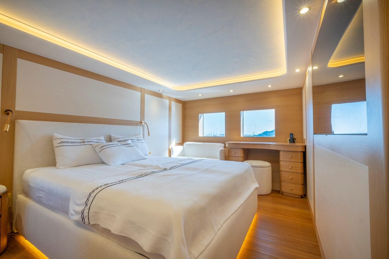 a bed in a room aboard MURAL 85 Yacht for Sale