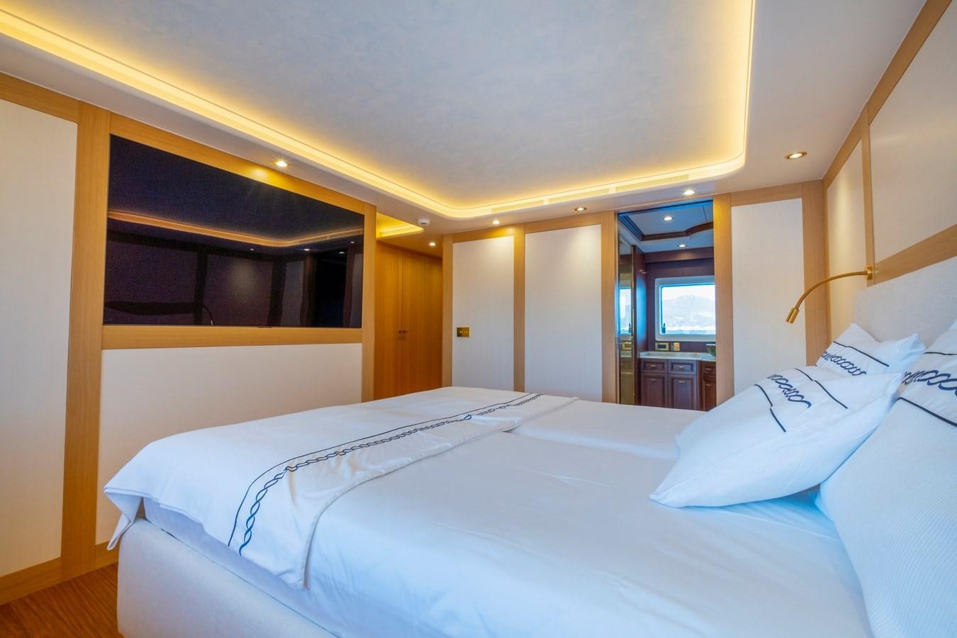 a room with a bed and a window aboard MURAL 85 Yacht for Sale