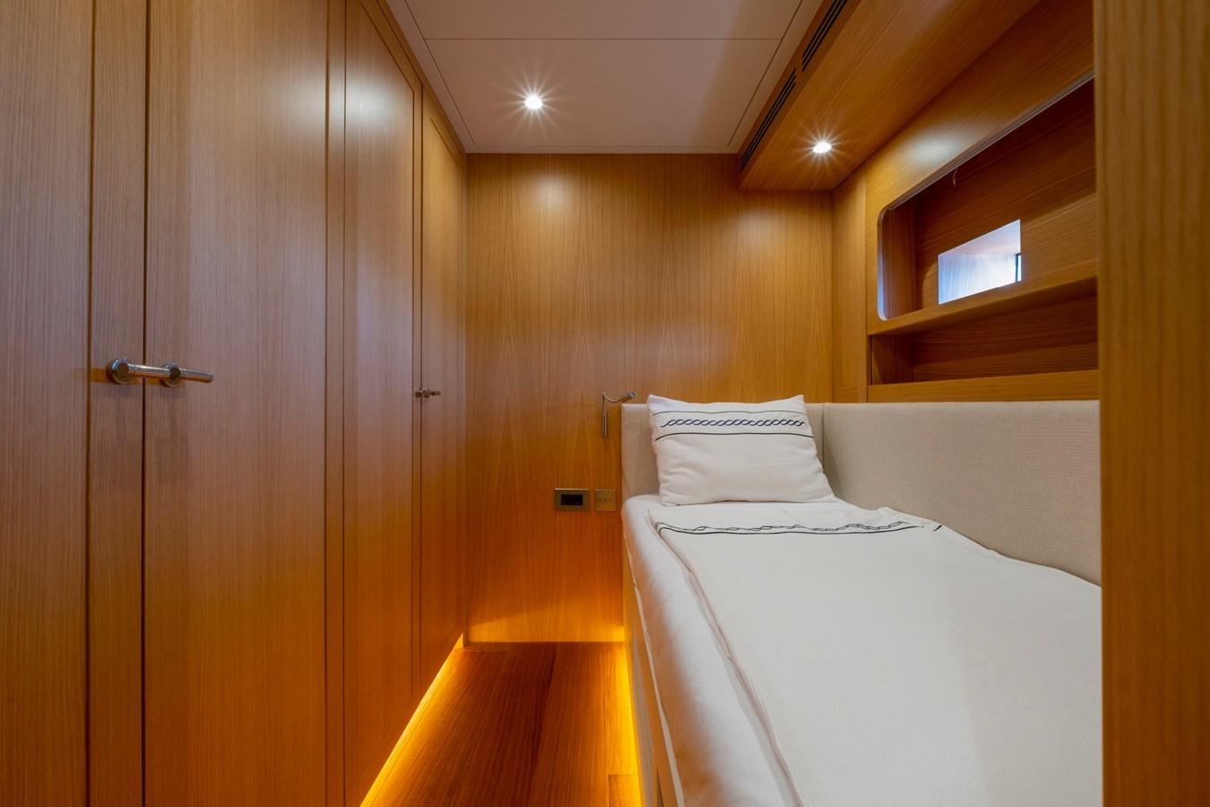 a room with a bed and a closet aboard MURAL 85 Yacht for Sale