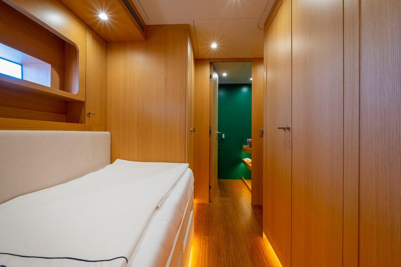 a room with a bed and a closet aboard MURAL 85 Yacht for Sale