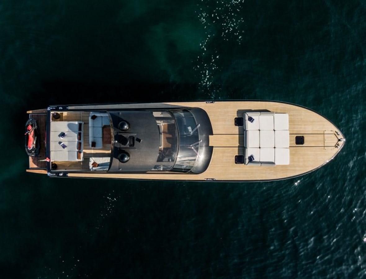 a yellow and silver boat on water aboard BLUE MAMBA Yacht for Sale