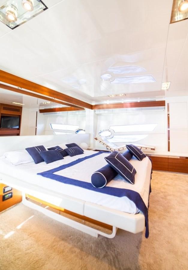 a room with a bed and a shelf aboard BLUE MAMBA Yacht for Sale