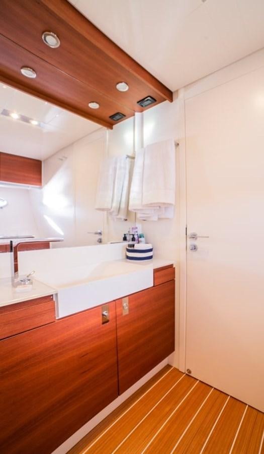 a bathroom with a tub and sink aboard BLUE MAMBA Yacht for Sale
