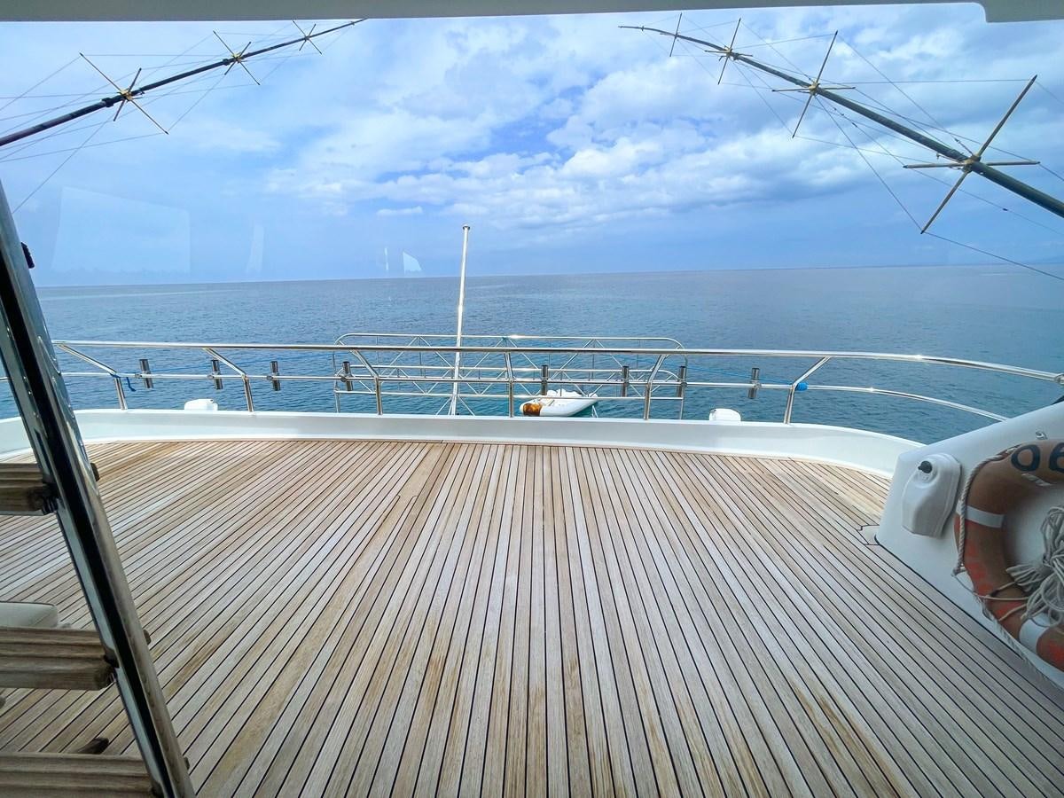 a deck overlooking a body of water aboard OBSESSIONS Yacht for Sale