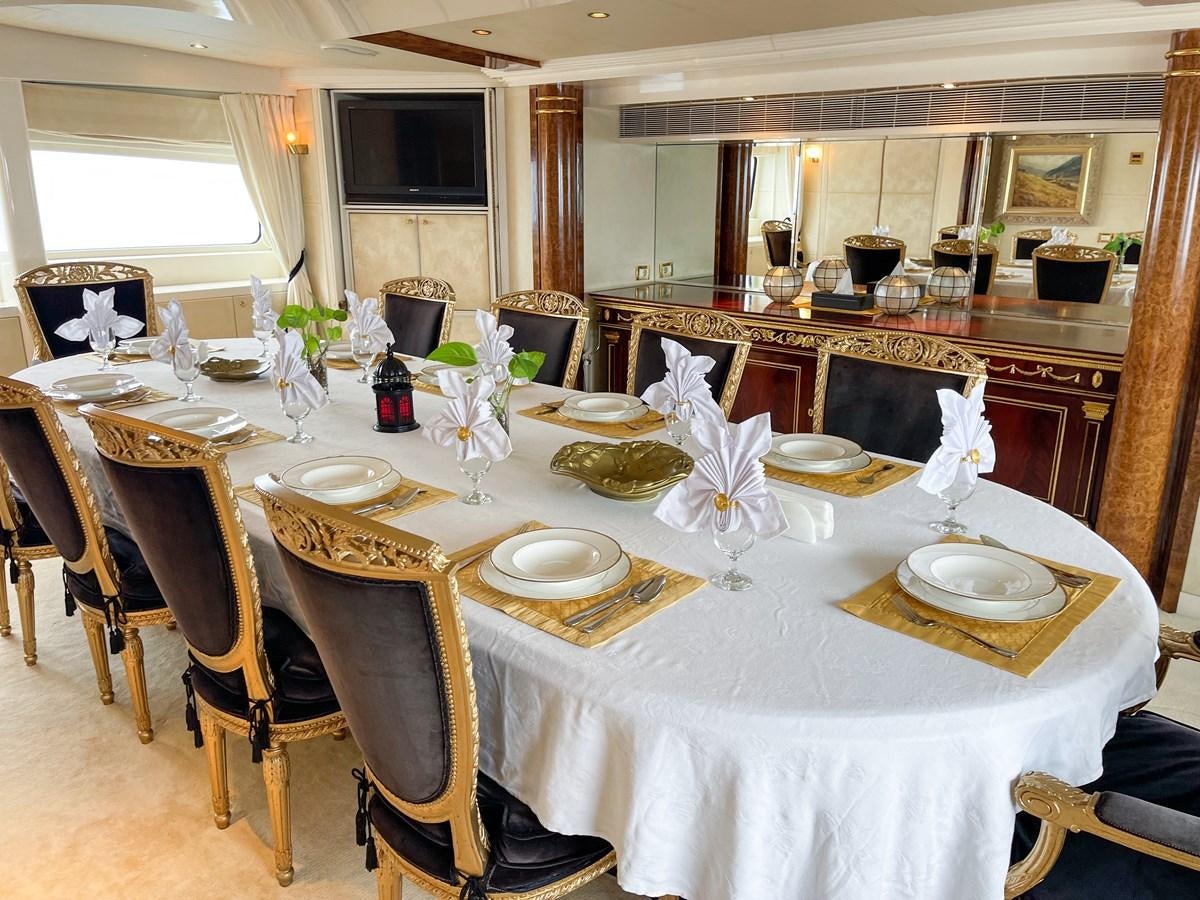 a table set for a dinner aboard OBSESSIONS Yacht for Sale