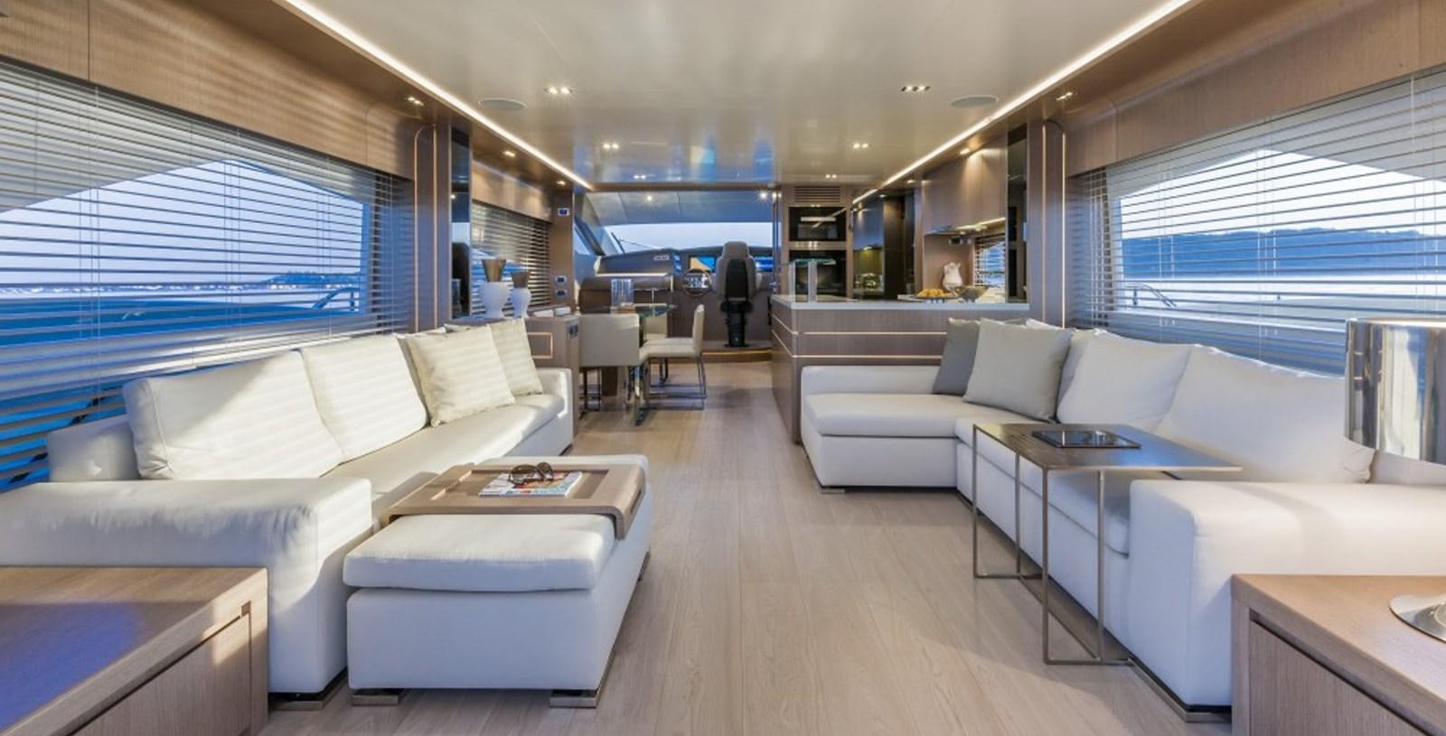 a room with a couch and a table aboard DOLLY Yacht for Sale