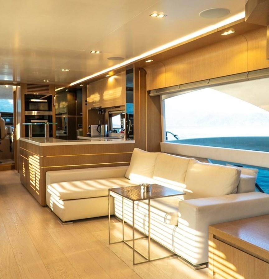 a room with a couch and a table aboard DOLLY Yacht for Sale