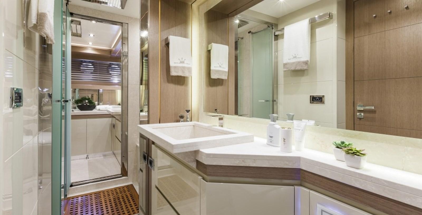 a bathroom with a large mirror aboard DOLLY Yacht for Sale