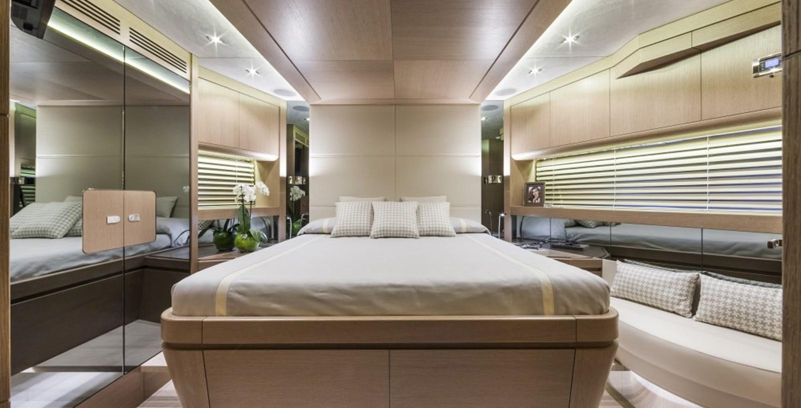a room with a bed and a window aboard DOLLY Yacht for Sale