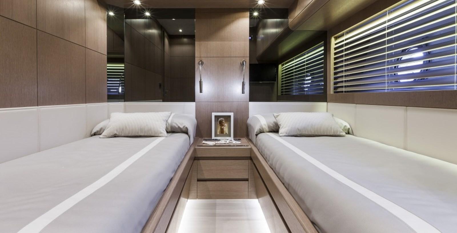 a room with two beds aboard DOLLY Yacht for Sale