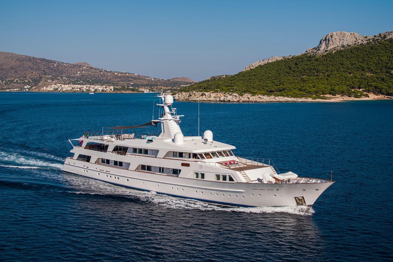 a white yacht on the water aboard ILLUSION I Yacht for Sale