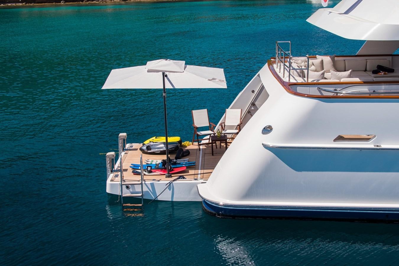 a boat is parked on the water aboard ILLUSION I Yacht for Sale