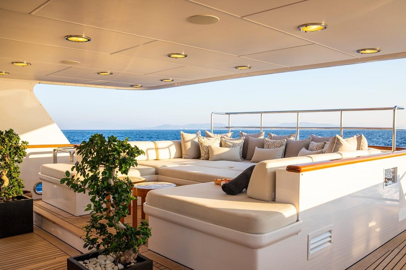 a living room with a large window aboard ILLUSION I Yacht for Sale