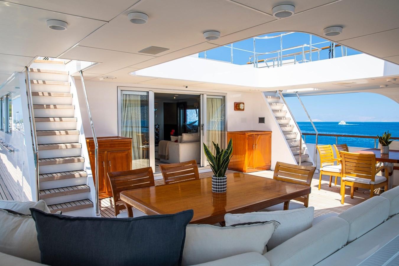 a living room with a large swimming pool aboard ILLUSION I Yacht for Sale