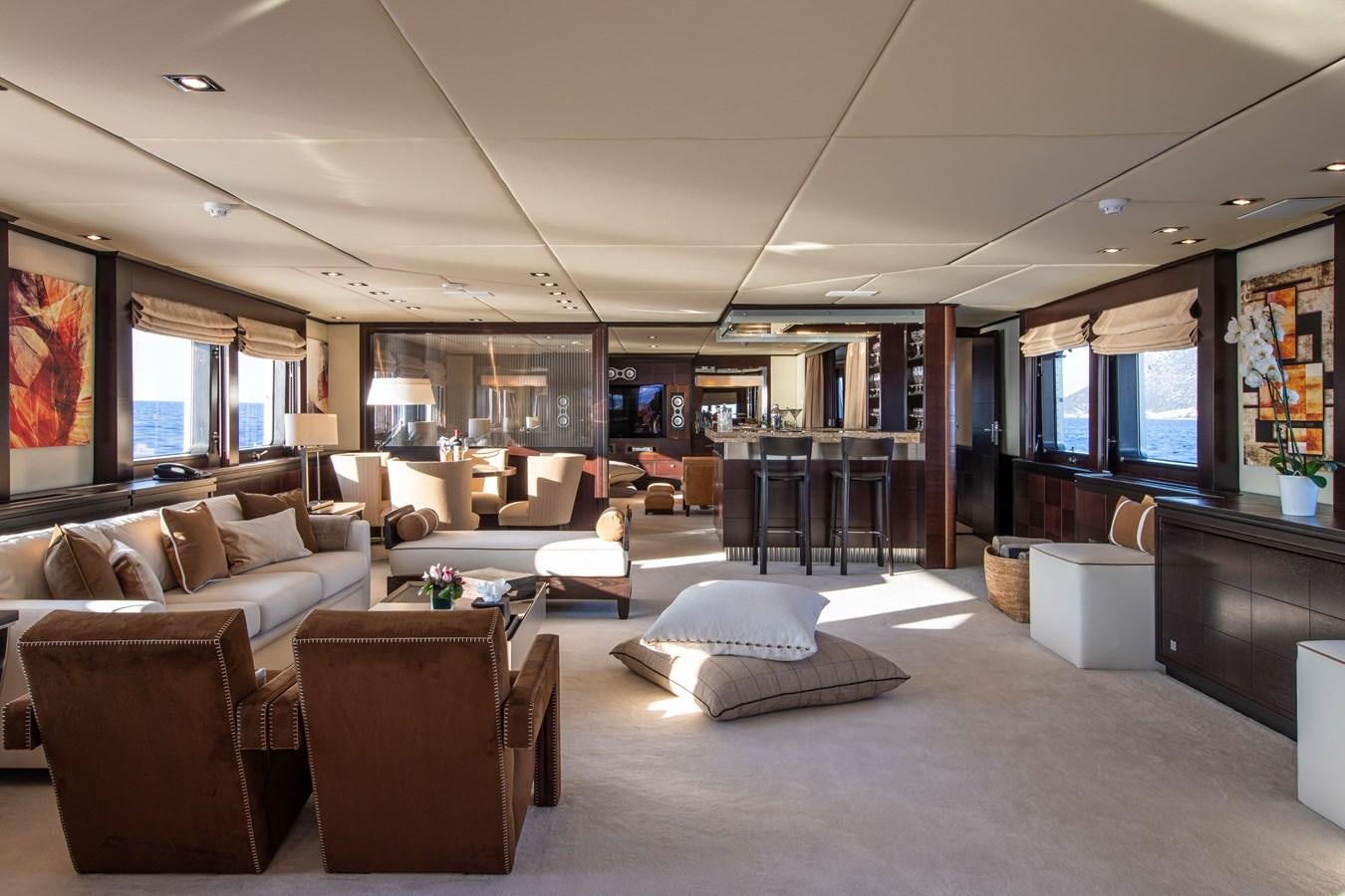 a living room with a large window aboard ILLUSION I Yacht for Sale