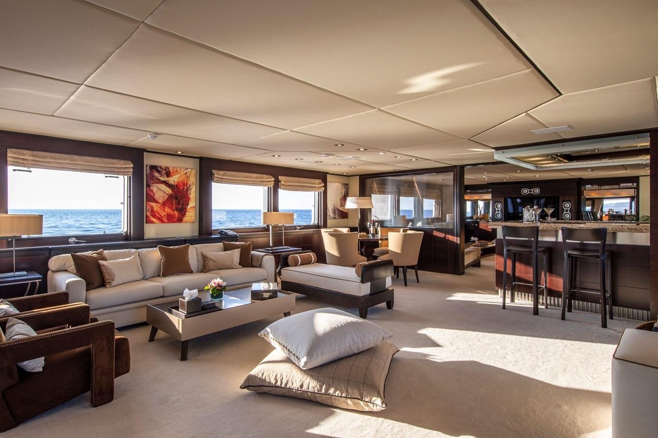 a living room with a large window aboard ILLUSION I Yacht for Sale