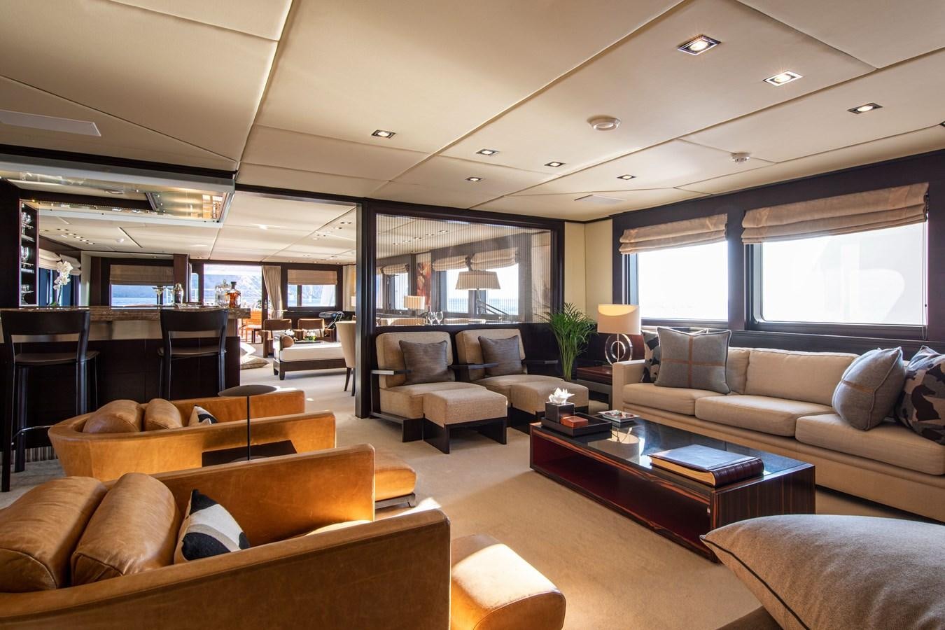 a living room with a large window aboard ILLUSION I Yacht for Sale