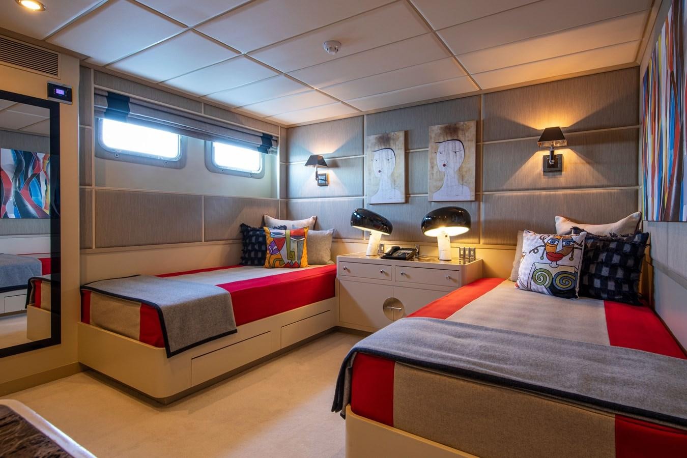 a bedroom with two beds aboard ILLUSION I Yacht for Sale