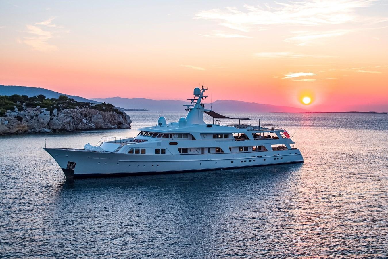 a white yacht in the water aboard ILLUSION I Yacht for Sale