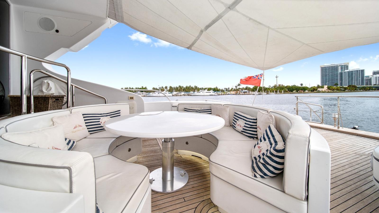 a boat with a table and chairs on it aboard DAYA Yacht for Sale