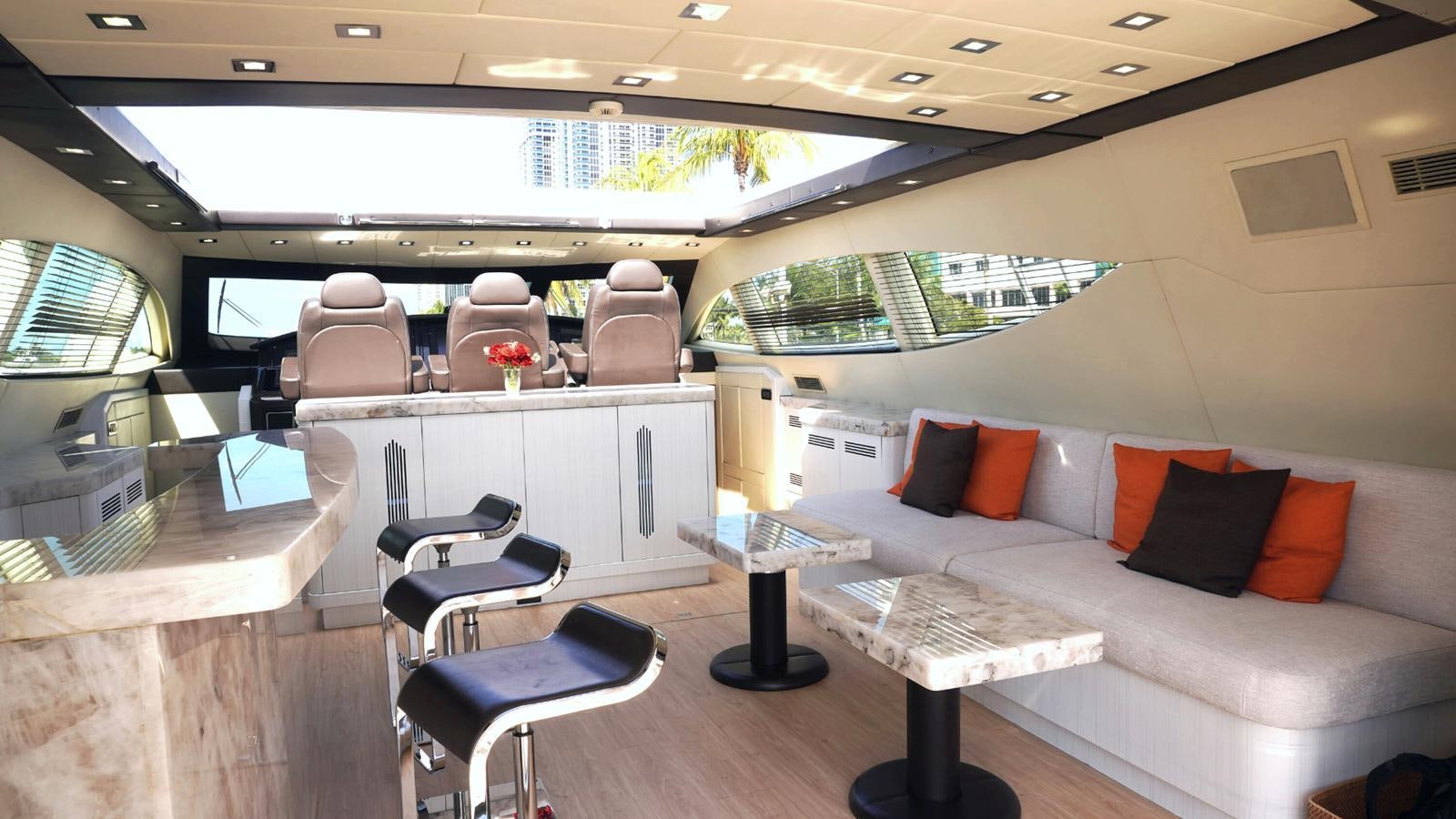 a room with a couch and a table and chairs aboard DAYA Yacht for Sale