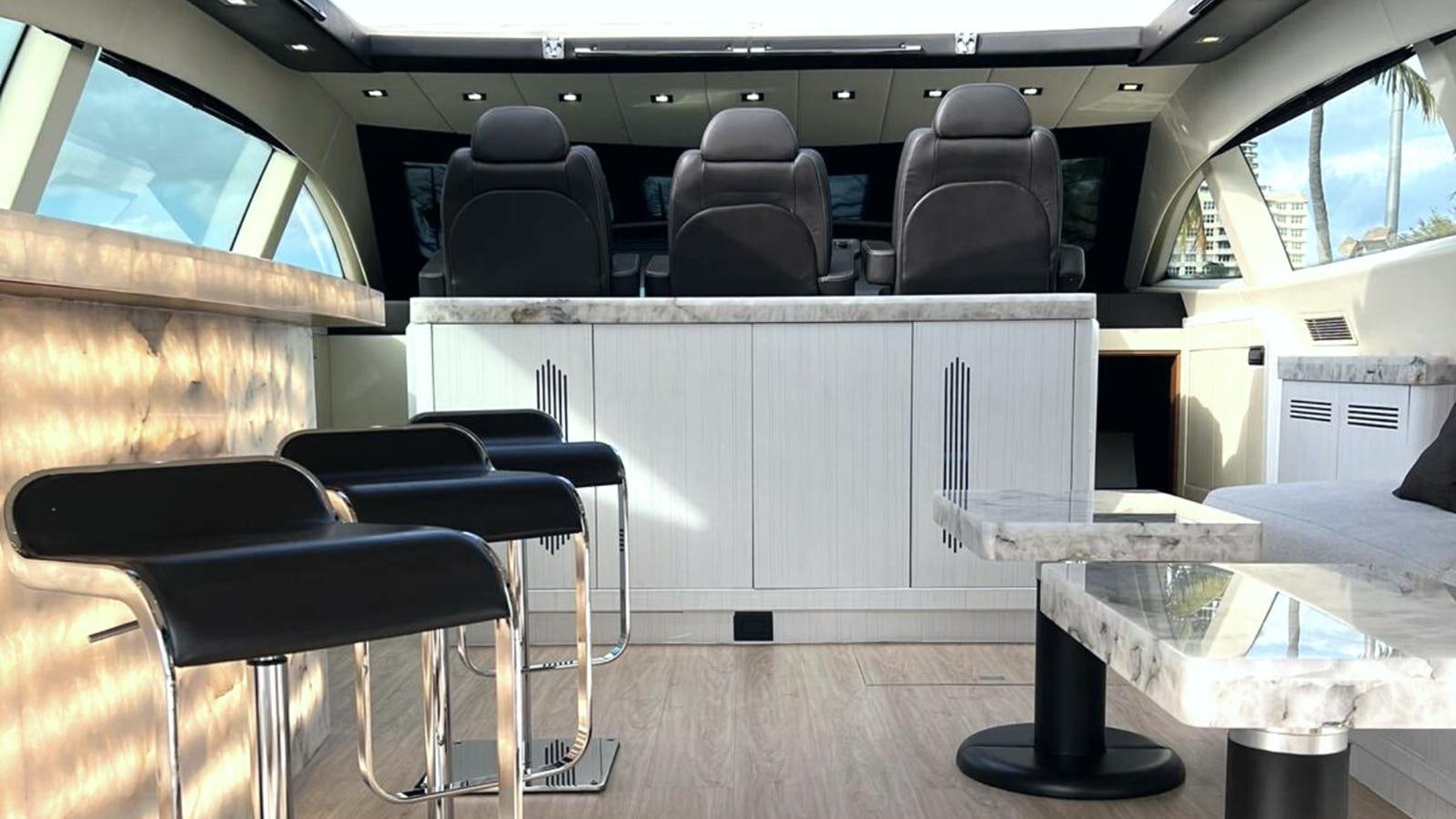 a room with chairs and a table aboard DAYA Yacht for Sale